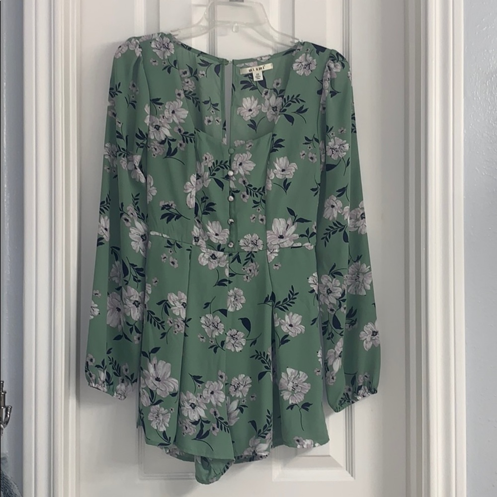 Francesca’s green floral romper